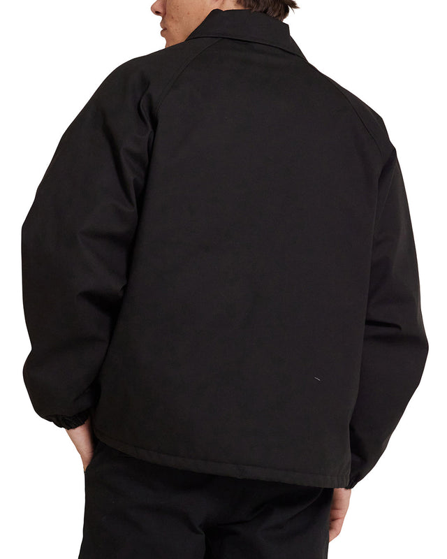 Chaqueta deportiva negra con logotipo de Pill